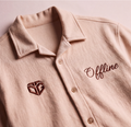 A close-up of a Oversized Boxy Fit Cream Shirt. The front features a matching embroidered geometric logo on the left chest and the word 'Offline' in script on the right chest.